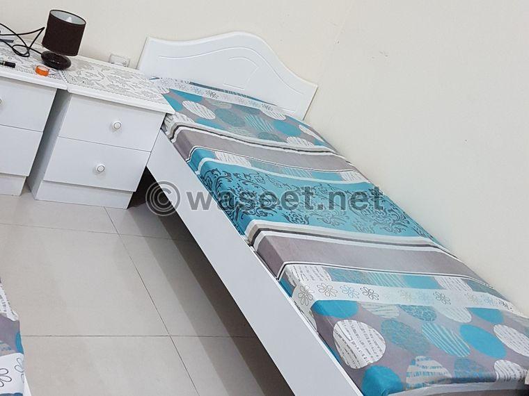 3 beds with mattresses and two tables for sale  1