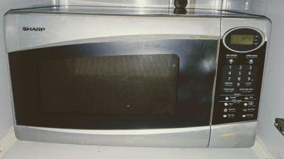 Refrigerator in very good condition or Sharp microwave